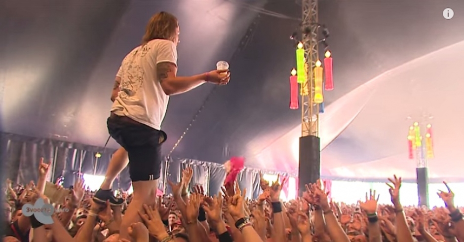 Lead Singer Catches Beer And Drinks It While Also Walking On Crowd