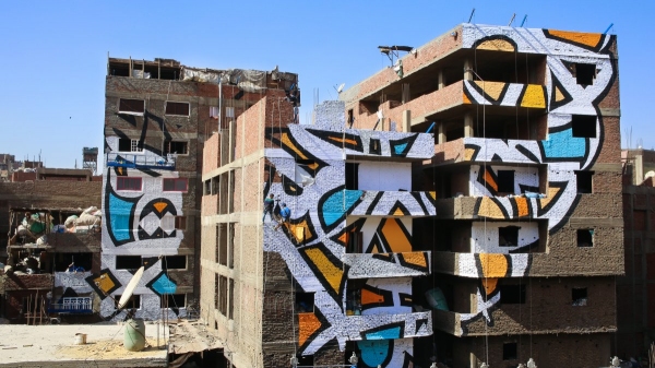 artist creates beautiful mural in cairo spanning across 50 buildings 9