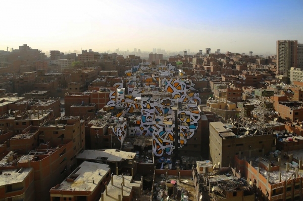 artist creates beautiful mural in cairo spanning across 50 buildings 11
